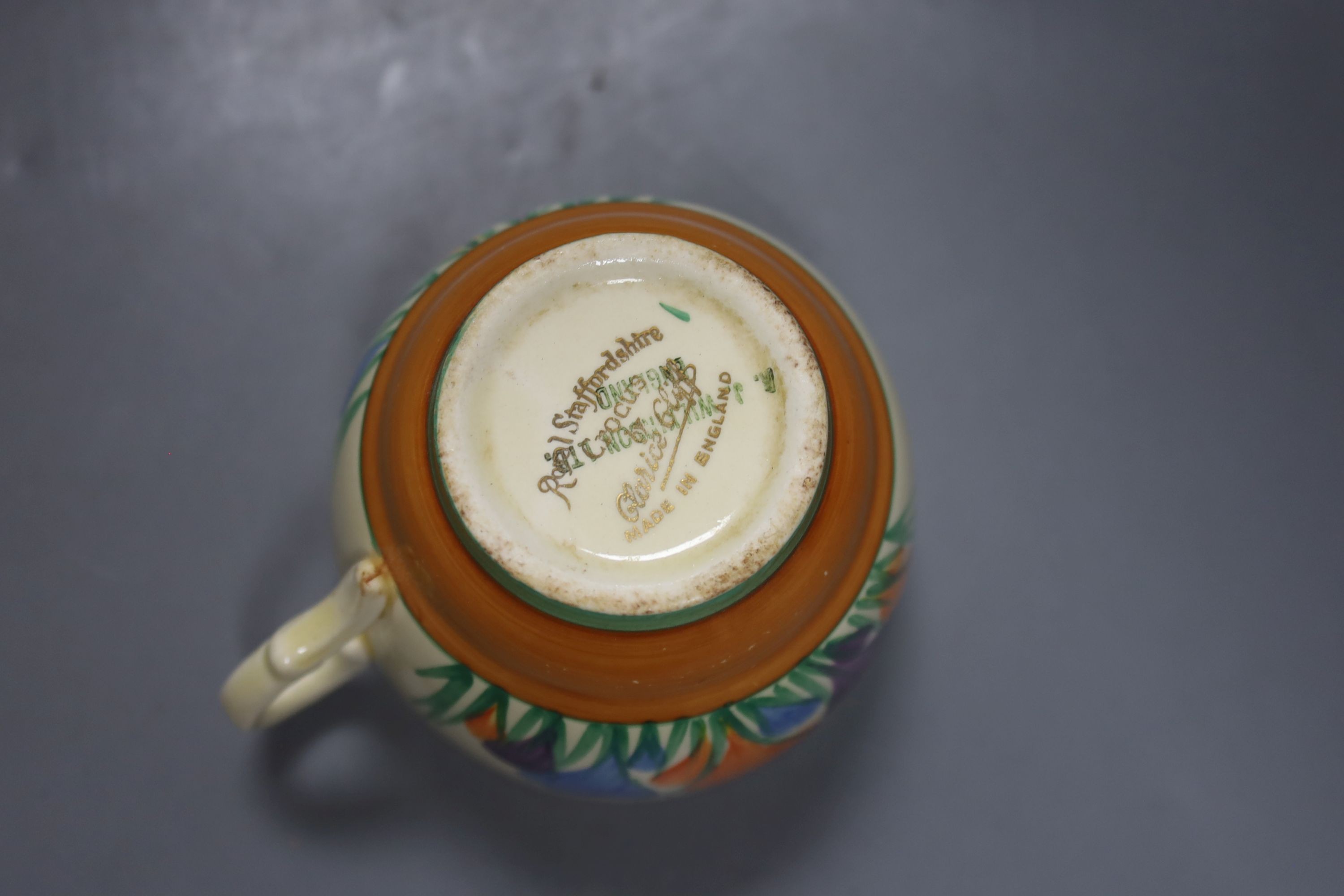 A quantity of Clarice Cliff pottery, Including Crocus pattern tea wares, two preserve jars missing Lids, a plate and three bowls